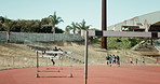 Runner, man and jump for hurdle outdoor of fitness competition, run exercise and sports performance. Male athlete, field and obstacle race with cardio training, olympics challenge and endurance goals