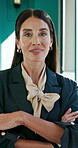 Arms crossed, face and smile with business woman in office for property developer, about us and pride. Confidence, real estate investor and professional with mature person in agency for opportunity