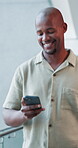 Walking, employee and man with smartphone, office and texting with contact for article and creative. Typing, online or black person with smile for message, journalist and communication with source