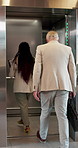 Building, walking and business people in elevator to office floor for work, company and travel in morning. Professional, team and workers in lift for transport, arrival and enter level for meeting