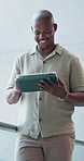 Smile, business and black man with tablet in office for research, email editor and story approval. Journalist, reading and digital for editing draft, funny feedback and proofreading for publication