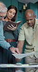 Business people, team and planning with paperwork in office, investment strategy or writing notes. Group, document and discussion in meeting for sales, financial idea or point for project development