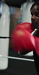 Fitness, pads or technique with boxer and personal trainer in gym for improvement or training. Combat sport, exercise or power with athlete and coach in boxing ring together for intense workout