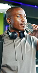Drinking water, fitness and health with black man in gym for workout break, electrolytes and athlete. Training recovery drink, exercise rest and liquid with person in sports club for wellness