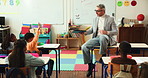 Tablet, education and teacher with children in classroom for lesson with question for learning. Digital technology, students and male educator with kids for development, growth or teaching at school.