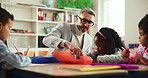 Conversation, man and students in classroom, education and help with child development. Group, teacher and kids in school, learning and knowledge with growth, drawing and discussion with creativity