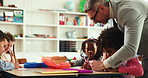 Help, man and students in school, education or discussion with child development. Group, teacher or kids in classroom, learning or knowledge with growth, drawing or feedback with creativity or advice