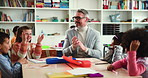 Man, teacher and children in classroom with applause, anatomy and development with education at school. Mature person, kids and happy with goal, celebration or show body parts for learning at academy