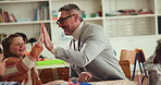 Man, teacher and children in classroom with high five, excited and development with education at school. Mature person, kids and group with goal, celebration and motivation for learning at academy