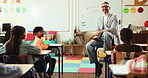 Kindergarten, question and lesson of teacher in classroom for education, support and study. Learning, child development and growth with students and man in school for creative, help and answer