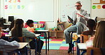 Education, teacher and lesson with kids in school for morning class, talking  and support. Learning, future and knowledge growth with group of students and man on campus for teaching and study