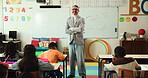 Kindergarten, arms crossed and face of teacher in classroom for education, writing and exam. Learning, child development and growth with students and man in school for creative, help and support