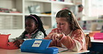Stationery, writing and girls in class with books for learning, child development and knowledge. Students, elementary school and kids with paper for education, drawing and creative lesson for growth