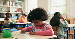 Education, writing and student in classroom at school for test, assessment or project for learning. Color pencil, child and girl kid with notebook for drawing with creative assignment at campus.