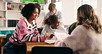 Group, classroom and students talking with notes for collaboration, learning and education. University, college and people in discussion for knowledge, assignment and lesson feedback at school
