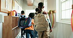 Walking, education and back of students in school for knowledge, study period and learning. Scholarship, growth and class schedule with group of kids on campus for child development and friends