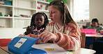 Stationery, writing and kids in class with paper for learning, child development and knowledge. Students, elementary school and girls drawing for education, studying and creative lesson for growth