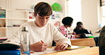 School, university and students in classroom studying for exam, test and quiz in lesson. College, academy and people writing notes and answers for education, knowledge and learning for assessment