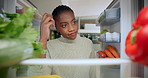 Food, fridge and scratching head with black woman in kitchen of home for cooking or groceries. Diet, meal planning and vegetables with pov of African person in apartment for nutritional recipe option