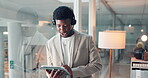 Business, black man and reading on tablet at call centre for customer service, client advice and crm. Agent, digital and discussion for online help, tech support and information on procedure guidance