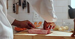 Hands, spices and steak with chef in kitchen of restaurant for preparation of gourmet meal. Cooking, cuisine and seasoning with person making protein food for culinary dish, fine dining or recipe