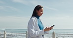 Beach, walking and woman with cellphone, travel and connection with summer holiday. Typing, ocean and person with smartphone, vacation and online chatting with social media, break or texting in Miami
