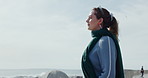 Calm woman, breathing and beach with fresh air on ocean coast or promenade for outdoor break. Female person, relax and thinking with wind breeze, sky or space for mental wellness, zen or sea view
