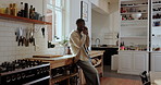 Black man, phone call and smile with talk in kitchen for discussion, laugh and funny joke at home. African person, happy and smartphone with conversation, gossip and chat with story at apartment