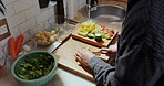 Hands, cooking and cut vegetables in kitchen for salad recipe, healthy food and meal preparation. Nutrition, person and organic ingredients in home for vegetarian diet, minestrone soup or dinner dish