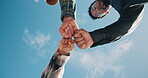 Fist bump, support and trust with students on blue sky for team, solidarity and college future. Community, success and University friends or people on campus for low angle and scholarship