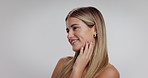 Skincare, smile and thinking with woman on studio space for cosmetics or dermatology results. Aesthetic, beauty and vision with happy model touching skin on white background for cosmetology benefits