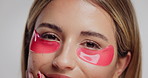 Eye mask, beauty and face of woman in studio for natural, skincare and facial glow with cosmetics. Happy, health and portrait of person from London with dermatology products by white background.
