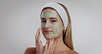 Mud mask, skincare and face of woman in studio with natural, wellness or health with cosmetics. Clay, detox and portrait of female person with facial product for dermatology by white background.