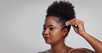 Black woman, serum and skincare with pipette in studio for facial treatment on a white background. Female person, African model or cosmetic product with dropper for vitamin C oil on mockup space
