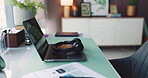 Creative, headphones and laptop on desk in home office for planning, remote work or research. Break, computer and documents on workstation in empty apartment for freelance or small business startup