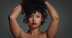 Face, woman and proud for hair care in studio of beauty, natural growth and afro volume. Portrait, African female person and textures for hairstyle, maintenance and scalp treatment on gray background