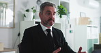 Business, video call and man in office, tech and financial agency with stock market. Mature person, virtual chatting and investor with online meeting, webinar and explain investment deal with app
