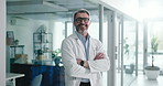 Crossed arms, man and face of doctor in hospital with confidence for healthcare career. Smile, medical support and portrait of professional male surgeon from London with pride for job in clinic.