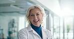 Happy, mature woman and face of doctor in hospital with confidence for healthcare career. Smile, medical support and portrait of professional female surgeon from London with pride for job in clinic.