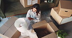 Above, woman and boxes with lamp in home or new house for packing with furniture. Female person, ownership and relocation with unboxing for moving in, property and real estate for rent or mortgage