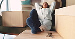 Relax, real estate and woman in new home with boxes, keys and move in house. Thinking, relocation and person in apartment with socks, property investment and mortgage loan for new beginning.