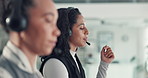Communication, headset and support with woman in call center together for feedback or virtual assistance. Contact us, customer service and solution with people in coworking office for consulting