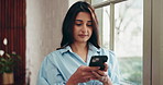 Cellphone, window and woman in office with contact, communication or chatting on mobile app. Technology, research and person with phone for texting, networking or social media on break in workplace.