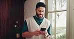 Cellphone, window and man in office with contact, communication or chatting on mobile app. Technology, thinking and person with phone for texting, networking or social media on break in workplace.