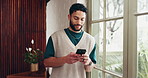 Phone, window and man in office with contact, communication or chatting on mobile app. Technology, thinking and person with cellphone for texting, networking or social media on break in workplace.