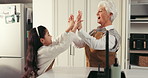 Grandmother, grandchild and high five with talking in home for support, encourage growth or bonding. Happy family, senior woman and girl with celebration for childhood milestone, connection and love