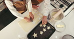 Baking, above and family in kitchen with cookie cutter to prepare dessert, biscuits and stars. Fun, ingredients and hands of grandmother with child for teaching, bonding and learning recipe in home