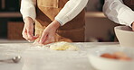 Hands, parent and kid with baking dough in kitchen for cookies snack, learning and development. Family, people and child kneading ingredients in home for culinary skills, helping and teaching recipe