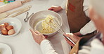 Baking, above and people in kitchen with bowl to prepare dessert, cookies and cake together. Family, ingredients and hands of grandmother with child for teaching, bonding and learning recipe in home