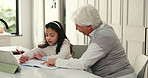 Girl, grandma and help with homework, writing and book with support, online course and education in home. People, grandmother and child with guide, learning and review for development at family house